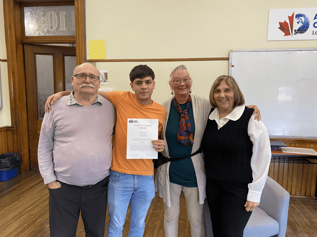 A happy ACLA homestay host family with a graduating student