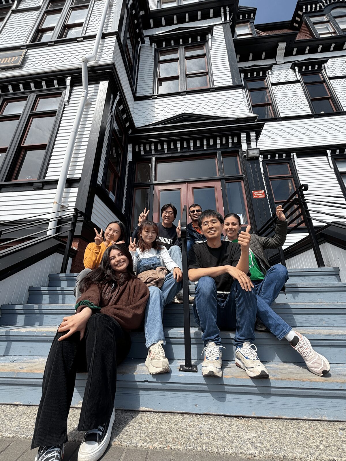 ACLA students sitting on the Academy front steps